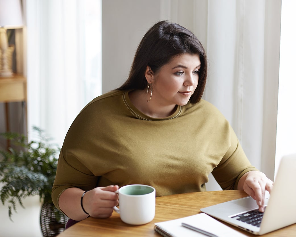 Woman looking at her laptop